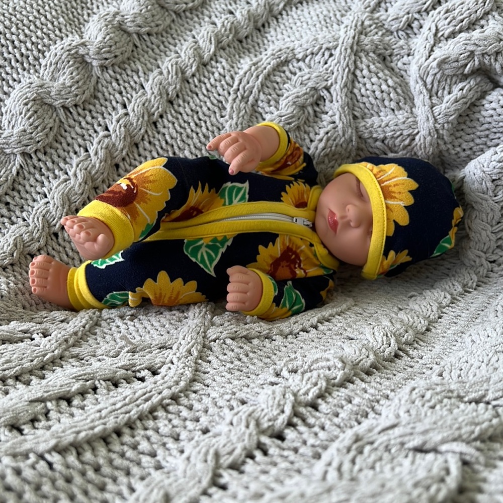 Cute newborn girl 10 inch doll with yellow sunflowers and leafs on outfit
